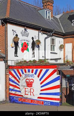 Billericay High Street The Crown public house with Lest We Forget poppy soldiers mural & Queen Elizbeth II Platinum E R Tribute painted on wall UK