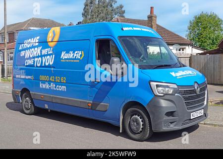 Kwick Fit business Home or Work tyre fitting service side & front view blue Renault Master van parked outside residential property Essex England UK Stock Photo