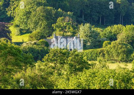 Early morning light on Midsummers Day (June 21st) on 17th century Abbey Farm in the Cotswolds at The Vatch near Stroud,  Gloucestershire , England UK Stock Photo