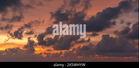 Beautiful sunset sky with some clouds during summer on a nice day Stock Photo