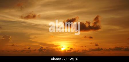 Beautiful sunset sky with some clouds during summer on a nice day Stock Photo