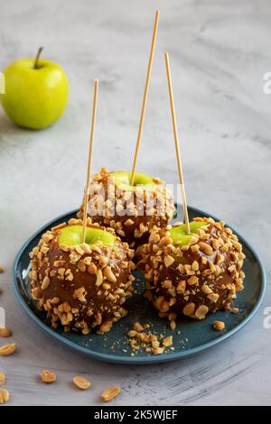 Homemade Halloween Candy Taffy Apples on a Plate, side view. Stock Photo