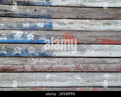 Faded American flag painted on rustic weathered wood Stock Photo