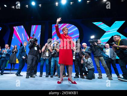 Aberdeen, Scotland, UK. 10th October 2022. First Minister Nicola Sturgeon addresses the Scottish National Party Conference on day three in Aberdeen, Scotland. Because of the Covid pandemic this year is the first time Scottish National Party Members have met for a conference since October 2019. Pic. Nicola Sturgeon waves to delegates after her speech.  Iain Masterton/Alamy Live News Stock Photo