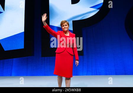 Aberdeen, Scotland, UK. 10th October 2022. First Minister Nicola Sturgeon addresses the Scottish National Party Conference on day three in Aberdeen, Scotland. Because of the Covid pandemic this year is the first time Scottish National Party Members have met for a conference since October 2019. Pic. Nicola Sturgeon waves to delegates after her speech.  Iain Masterton/Alamy Live News Stock Photo