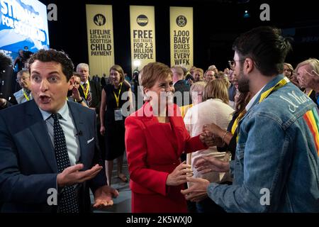 Aberdeen, Scotland, UK. 10th October 2022. First Minister Nicola Sturgeon addresses the Scottish National Party Conference on day three in Aberdeen, Scotland. Because of the Covid pandemic this year is the first time Scottish National Party Members have met for a conference since October 2019. Pic. Nicola Sturgeon greets delegates after her speech.  Iain Masterton/Alamy Live News Stock Photo