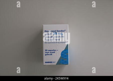 Photo of package of omeprazole capsules ('omeprazol' in dutch), produced by Sandoz Stock Photo