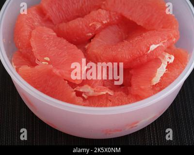 A bowl with grapefruit slices in it. Close up. Stock Photo