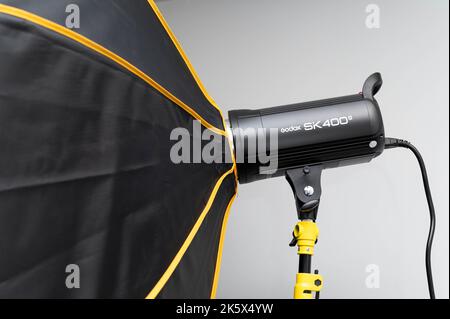 A studio strobe light flash with an umbrella Stock Photo