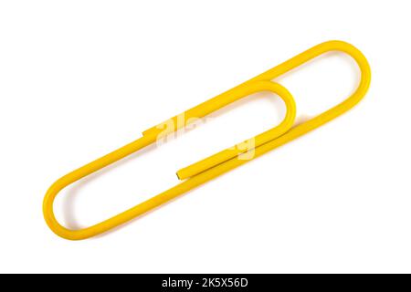 Yellow Paper clip isolated on white background Stock Photo