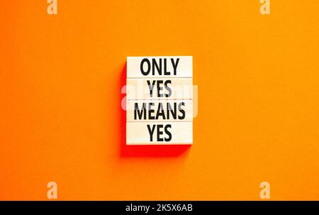 Only yes means yes symbol. Concept words Only yes means yes on wooden blocks on a beautiful orange table orange background. Business, psychological on Stock Photo