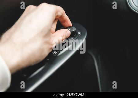Rearview Mirror Switch with heat control. Car Mirror Adjust Button Control. Modern car interior. Stock Photo