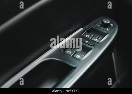 Close-up of the Side door Buttons: opening window and Mirror Switch Adjust Button adjustment buttons Stock Photo