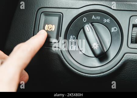 Car button for electronic handbrake. Parking brake Stock Photo