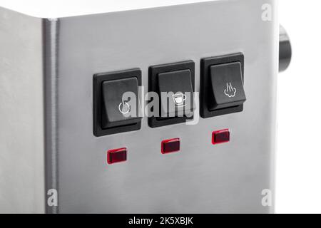 Black buttons for control making coffee with white icons, close-up of the panel with buttons and red indicators for gray steel espresso coffee machine Stock Photo