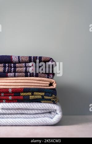 Stack of woolen checked blankets Stock Photo