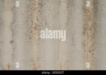 Gray wavy slate for the roof. Vertical view. Close-up. Background. Texture. asbestos sheets old roof, old grey metal background. the view from the top Stock Photo