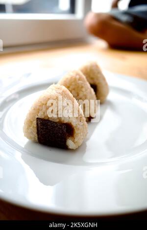 Onigiri, also known as omusubi, nigirizushi, or rice ball, is a ...