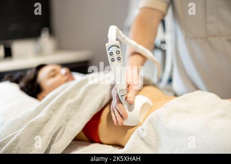 Woman was receiving treatment for cellulite. Slimming vacuum massage  machine. Vacuum massage of the buttocks and legs. Anti-cellulite body shape  procedure. Young woman and doctor in medicine salon Stock Photo - Alamy