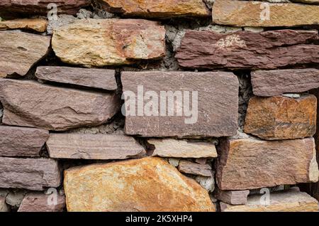 pattern gray color of modern style design decorative uneven cracked real stone wall surface  Background with stone texture Stock Photo