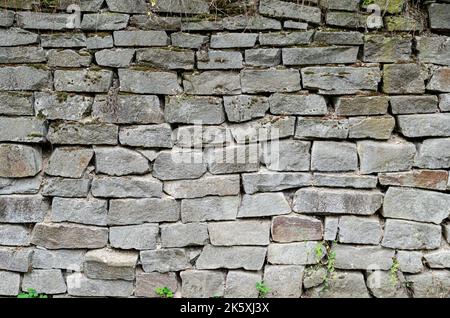pattern gray color of modern style design decorative uneven cracked real stone wall surface  Background with stone texture Stock Photo