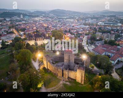 Aerial views of Guimaraes Castle. Cityscape seen from the air at sunset Stock Photo
