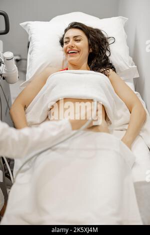 Woman during an ultrasound examination of abdominal cavity Stock Photo