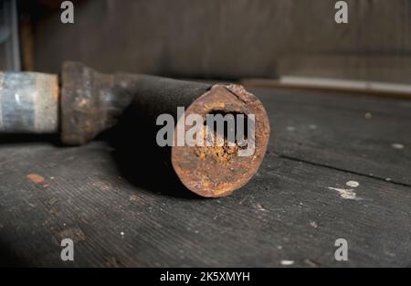 Clogged rusty water pipe Stock Photo