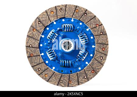 New car clutch plate isolated on white. Blue central part of clutch with springs and new friction plate. Stock Photo