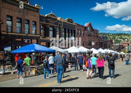 Historic buildings and crowd during Donkey Derby Days, Main Street, Cripple Creek, Colorado USA Stock Photo