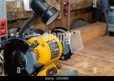 New Hope, Minnesota - October 1, 2022: A Pro-Tech bench grinder on a workbench in a garage Stock Photo