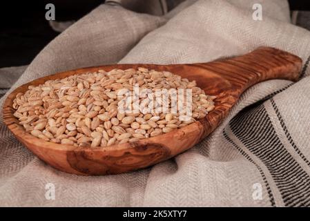 dried seeds food on a wooden spoon Stock Photo