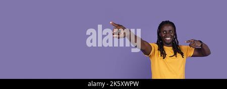 Cool african american young man pointing at copy space Stock Photo