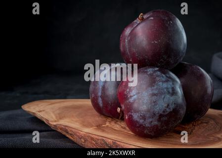 Fresh purple plum  on black background Stock Photo