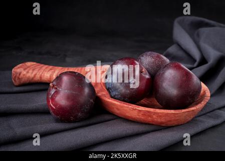 Fresh purple plum  on black background Stock Photo