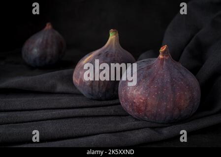 Fresh sweet fruit figs on a dark background Stock Photo