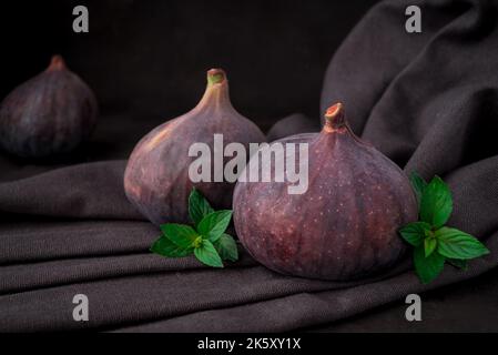 Fresh sweet fruit figs on a dark background Stock Photo