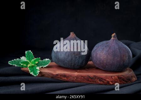 Fresh sweet fruit figs on a dark background Stock Photo