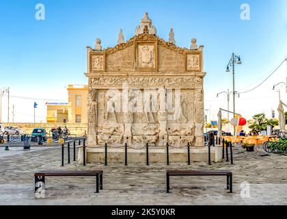 Greek Fountain of Gallipoli, built in the 16th century with Leccese sandstone, with caryatidis and basreliefs, in Gallipoli, province of Lecce, Italy Stock Photo