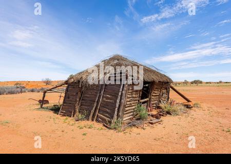 Derelict thatched timber shed at Old Andado Station in the Australian Outback, Northern Territory, NT, Australia Stock Photo