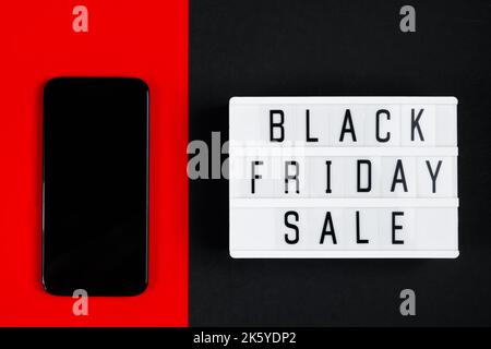 Black Friday online sale concept. Monochromatic flatlay on a dark background. Stock Photo