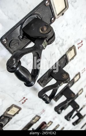 Retro electrical circuit breakers on the control panel Stock Photo