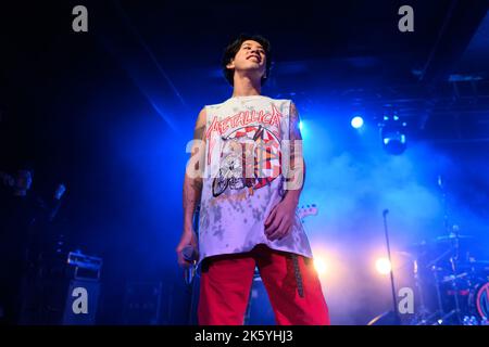 Taka of One Ok Rock performs on stage during the 