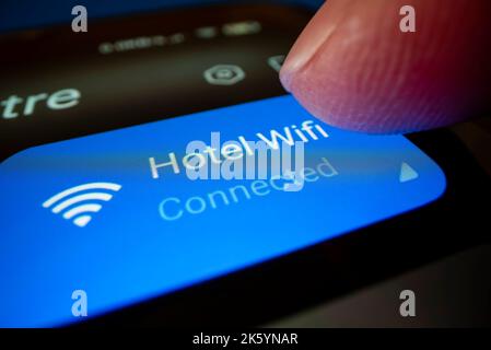 Close-up view of connecting smartphone to hotel wifi, shot with macro probe lens Stock Photo