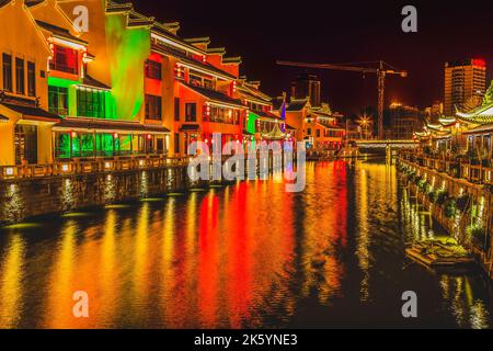 Colorful Water Canal Illuminated Night Near Nanchang Temple Wuxi Jiangsu Province China Wuxi is one of the oldest cities in China and canal city. Stock Photo