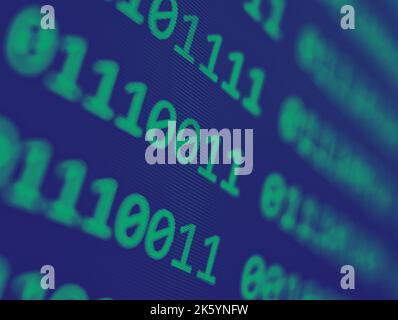 Binary computer code with grid of green 1s and 0s displayed on a blue screen with a focus blur effect Stock Photo