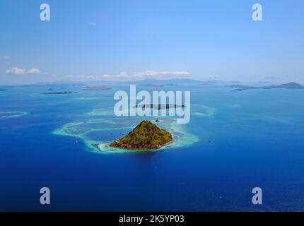 Small tropical island in the ocean, Maldives. Shot was taken from seaplane. Stock Photo