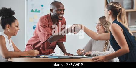 Diversity partnership, team and handshake for startup company, job interview and approved contract. Happy, team and employees agree on successful Stock Photo