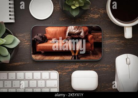chatty book with a smartphone, buying book or enternet course education . home training Stock Photo