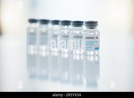 Healthcare, medicine and covid vaccine bottle, stock and product in a hospital office. Healthcare with a virus cure, wellness or corona drug in a Stock Photo